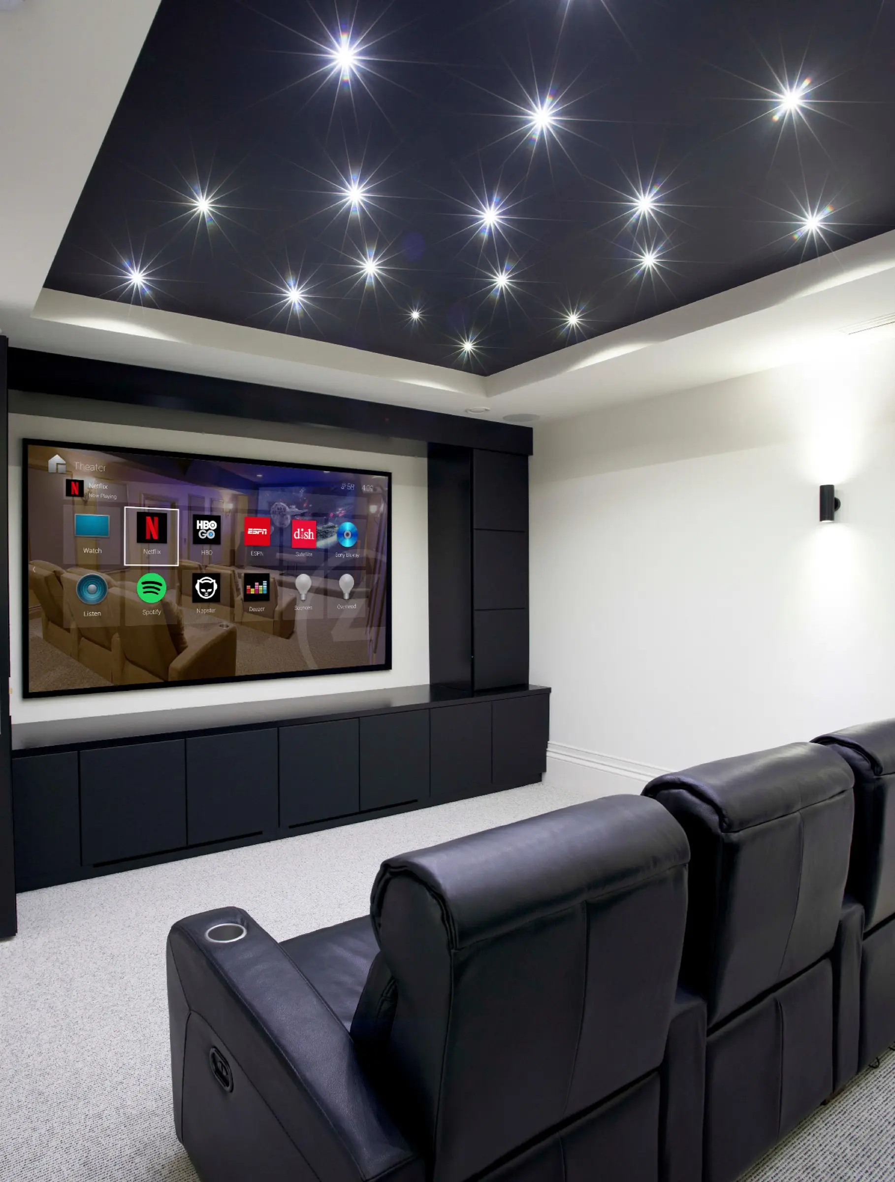 Dedicated home theatre with star-field ceiling and Control4 on screen